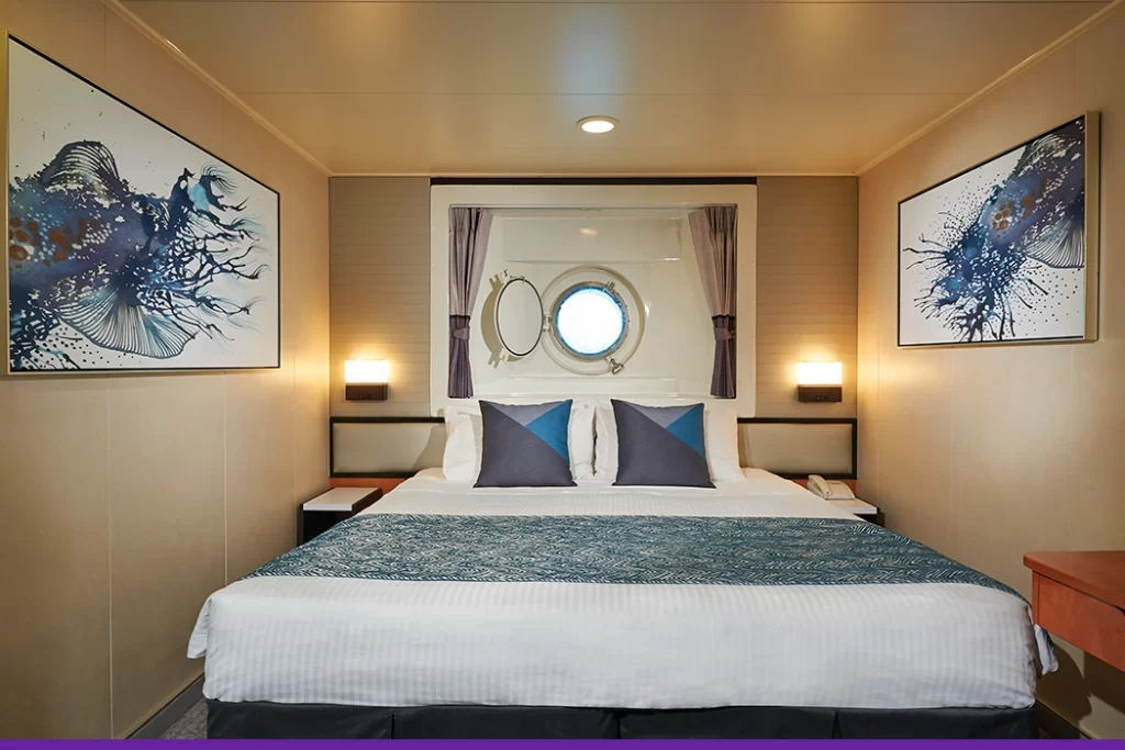 Temptation-Cruises-Suites-Oceanview-Porthole-01-1050x700px