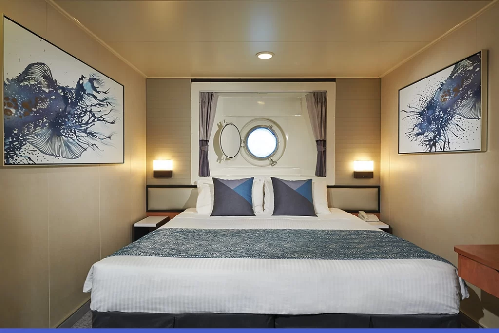 Temptation-Cruises-Suites-Oceanview-Porthole-01-1050x700px