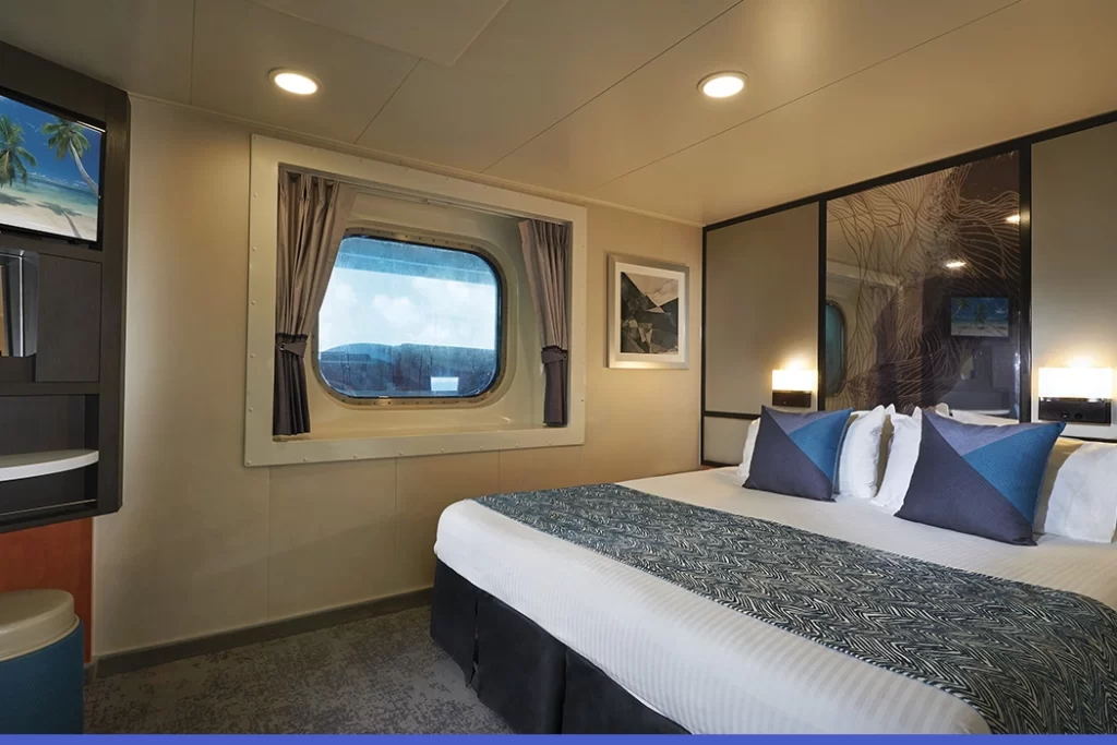 Temptation-Cruises-Suites-Oceanview-Stateroom-Obstructed-View-01-1050x700px
