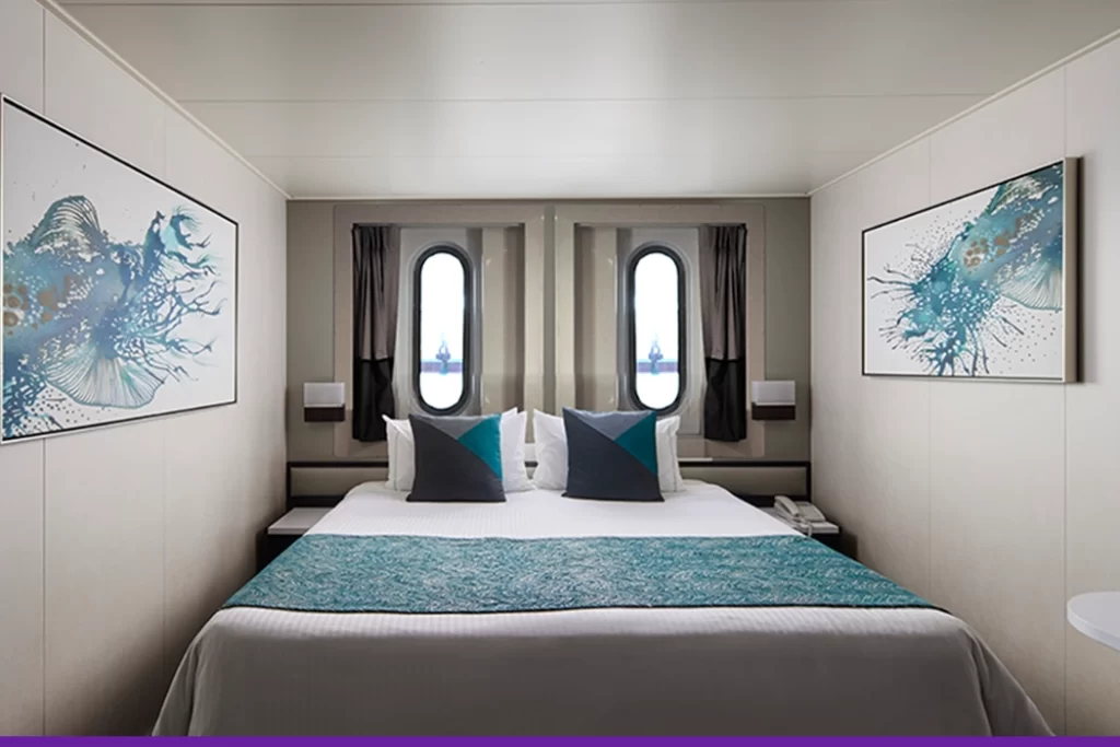 Temptation-Cruises-Suites-Oceanview-Stateroom-Obstructed-View-01-1050x700px